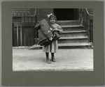 A small girl bringing homework to her tenement home, 1912