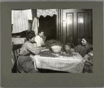 Mrs. Mary Rena is shelling nuts, December 1911