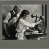 A 15-year-old girl operating an embossing machine, January 1917