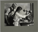 A 15-year-old girl operating an embossing machine, January 1917