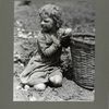 A four-year-old child helping her family pick up potatoes, 1931