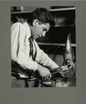A boy making a wrought iron lamp in a Brooklyn school, 1925