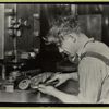 Assembly line, man with pliers bends rounded parts