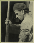 Man crushing faulty light bulbs for melting in the furnace