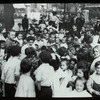 Work with schools, Hudson Park Branch : librarian surrounded by sea of children, ca. 1910s, Hudson Park