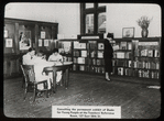 Work with schools, teachers' reference room : consulting permanent exhibit of books for young people, woman and students from trade school, June 1938