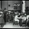 Work with schools, Tompkins Square : class from P.S. looking up N.Y. City history, Revolutionary period, one girl at card catalog, ca. 1910