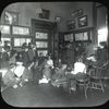 Work with schools : Dan Beard telling a story to a group of boys and girls in the Flatbush Library (L.I.) in 1913