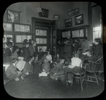 Work with schools : Dan Beard telling a story to a group of boys and girls in the Flatbush Library (L.I.) in 1913