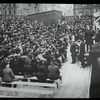 Central building, cornerstone laying : man in top hat mortaring stone