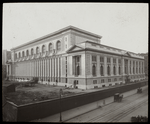 Central building, exterior views : Bryant Park and 40th street facades from 40th Street looking northeast, wagon on street