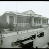 Central building, exterior views, Fifth Avenue, 1914-1916 : Fifth Avenue facade from 42nd and Fifth, traffic in foreground, July 1916