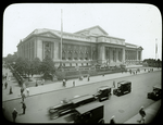 Central building, exterior views, Fifth Avenue, 1914-1916 : Fifth Avenue facade from 42nd and Fifth, traffic in foreground, July 1916