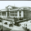 Central building, exterior views, Fifth Avenue : above Fifth Ave. and 42nd Street, looking southwest, library wagons, double-decker bus, cars, ca. 1910s? or 1920s?