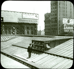 Central building : roof showing new skylight as installed (illustrating the use of the camera in job reporting), man standing on roof, view to the northeast?