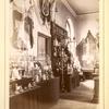 Stand with oil lamps, bird cages, and other artifices