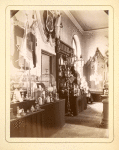 Stand with oil lamps, bird cages, and other artifices