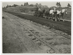 Repair of oil dirt road. Fair Oaks Street, So. Pasadena, Cal.  Regrading material in roadway, 1912.