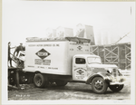 Model T-16 B-K-46; people loading furniture in Keeshin Motor Express Co. Inc. truck