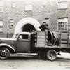 Model T 16A - G12; people working from the truck labeled A.C. Meyers Welding Service