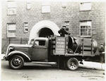 Model T 16A - G12; people working from the truck labeled A.C. Meyers Welding Service