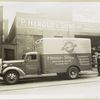 Model T 16 B - D 16  people loading supplies from building labeled P. Herold & Sons Inc. 