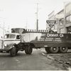 Model T 16 - L 8 in front of Stuart Oxygen Co.; loading cylinders