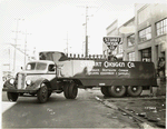 Model T 16 - L 8 in front of Stuart Oxygen Co.; loading cylinders