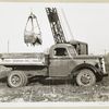 Model  T 18 HA loading onto Hyman Korman Inc. Builders truck
