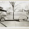 Model T 14 B Pick up 15; two workers loading furniture onto Argentine Furniture truck