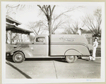 Model T 14 B Pick up 15; two workers loading furniture onto Argentine Furniture truck