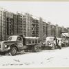 Model T 46 B C 42; trucks lined up at a construction site