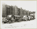 Model T 46 B C 42; trucks lined up at a construction site