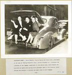 Hollywood actresses in Buick coupe.