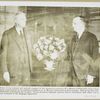 M. J. Murray of Oldsmobile being congratulated  on his 90th birthday by C. L. McCuen, Oldsmobile general manager