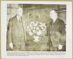M. J. Murray of Oldsmobile being congratulated  on his 90th birthday by C. L. McCuen, Oldsmobile general manager