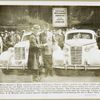 Mayor Edward J. Kelly, honorary chairman of Chicago's Charter Jubilee, receiving  Oldsmobile Six and Eight