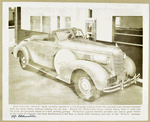 1937 - Oldsmobile -customer in a drive-in bank doing business