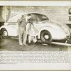 Oldsmobile Six being inspected by Harold T. Youngren, Oldsmobile's chief engineer and J. F. Wolfram