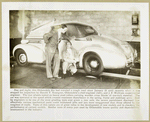 Oldsmobile Six being inspected by Harold T. Youngren, Oldsmobile's chief engineer and J. F. Wolfram