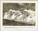 Strikingly modern and distinctively different front end designs which distinguish the 1938 Oldsmobile Six (right) and the Oldsmobile Eight