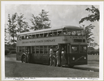 72 Passenger Double Deck Coach - Model 720 - Chicago Motor Coach Company with passengers boarding.