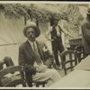 Arnold Bennett (smoking and looking at girl sitting next)