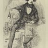 Charles Dickens. (Sitting on chair)