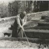 Gertrude Stein at the formal garden of her villa at Bilignin, with Pepe