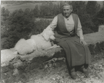 Gertrude Stein, with Basket I, on the terrace of the villa at Bilignin