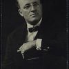 Hugh Walpole (seated, with spectacles and cigarette)