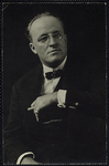 Hugh Walpole (seated, with spectacles and cigarette)