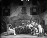 Scene "courtyard: Catfish Row, Charleston, S.C." designed by Cleon Throckmorton for "Porgy" original production. NYC: Guild Theatre, 1927. [Rose Macclendon, Evelyn Ellis, Percy Verwayne, Frank Wilson, et al.]