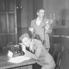 Osgood Perkins (standing) as Walter Burns and Lee Tracy (seated) as Hildy Johnson, Herald-Examiner.
